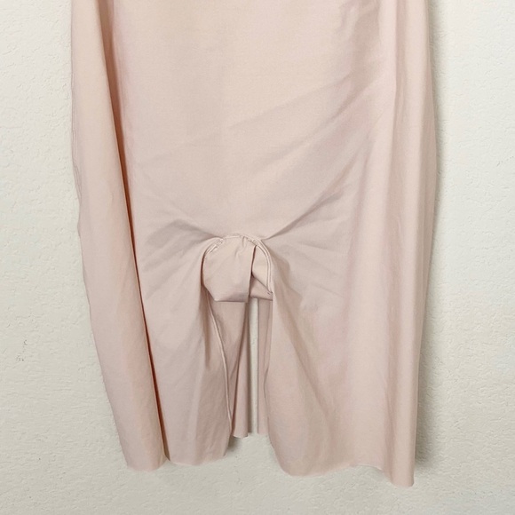 SPANX Thinstincts 2.0 Open-Bust Mid-Thigh
Bodysuit in Nude - Picture 5 of 13
